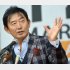 15年12月、日比谷野音での集会で演説（Ｃ）日刊ゲンダイ