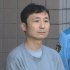 送検される田辺容疑者（Ｃ）日刊ゲンダイ